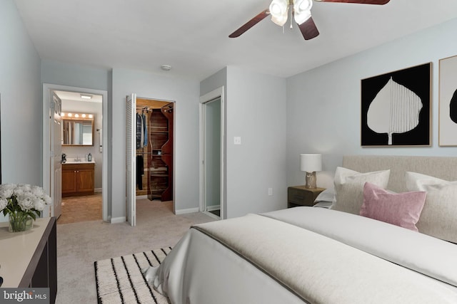 430 Cedar Creek Dr, Harpers Ferry, WV 25425 - bedroom with light colored carpet, a spacious closet, ensuite bath, a closet, and baseboards
