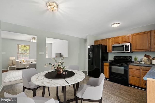 430 Cedar Creek Dr, Harpers Ferry, WV 25425 - kitchen featuring black appliances, brown cabinets, wood finished floors, and baseboards