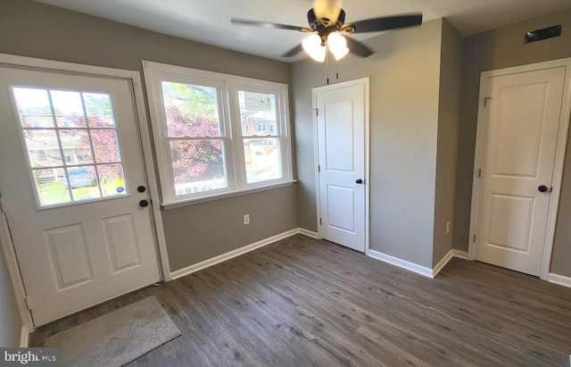 248 W Edgevale Rd, Baltimore, MD 21225 - doorway to outside featuring dark wood-style floors, a ceiling fan, and baseboards