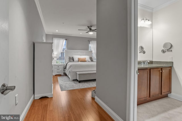 11249 Chase St Unit 100, Fulton, MD 20759 - bedroom featuring crown molding, baseboards, light wood-type flooring, and ceiling fan