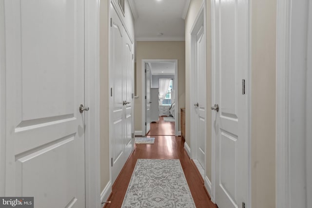 11249 Chase St Unit 100, Fulton, MD 20759 - hallway featuring ornamental molding, dark wood-style floors, and baseboards