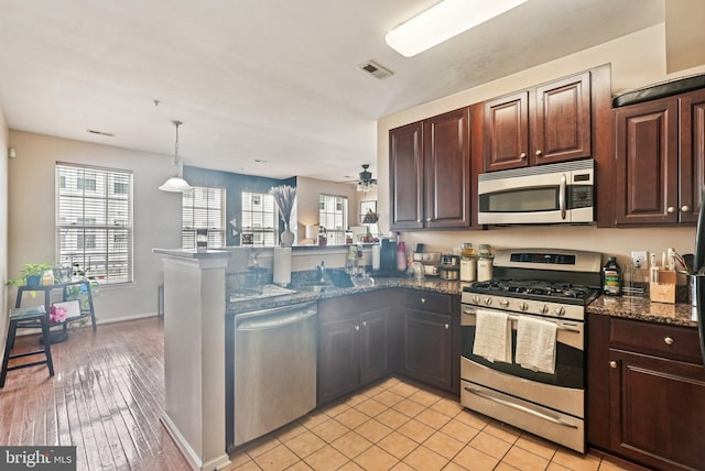 361 Union St, Trenton, NJ 08611 - kitchen with appliances with stainless steel finishes, a peninsula, dark brown cabinets, and ceiling fan
