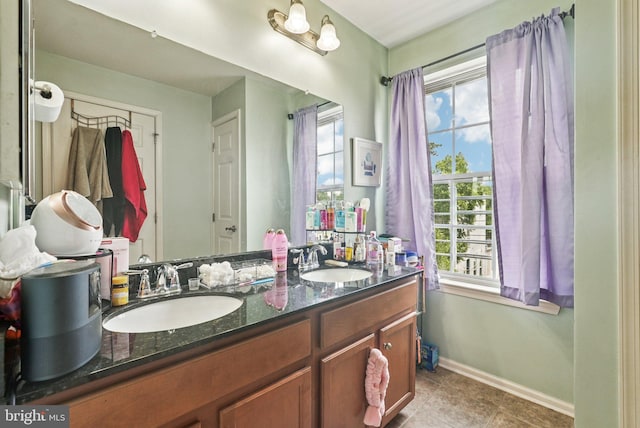 361 Union St, Trenton, NJ 08611 - full bathroom with double vanity, plenty of natural light, and tile patterned flooring