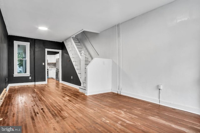 342 W Gay Ave, York, PA 17401 - unfurnished living room with stairs, hardwood / wood-style flooring, and baseboards
