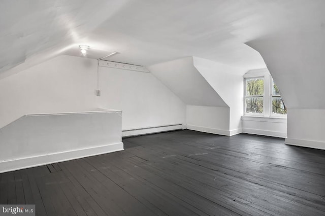 342 W Gay Ave, York, PA 17401 - additional living space with a baseboard heating unit, vaulted ceiling, dark wood-type flooring, and baseboards