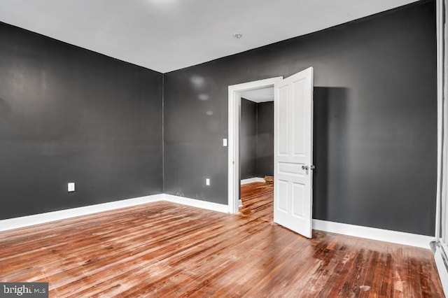 342 W Gay Ave, York, PA 17401 - spare room featuring wood finished floors, baseboards, and a baseboard radiator