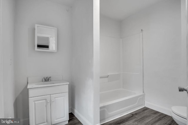 342 W Gay Ave, York, PA 17401 - bathroom featuring toilet, vanity, baseboards, wood finished floors, and shower / tub combination