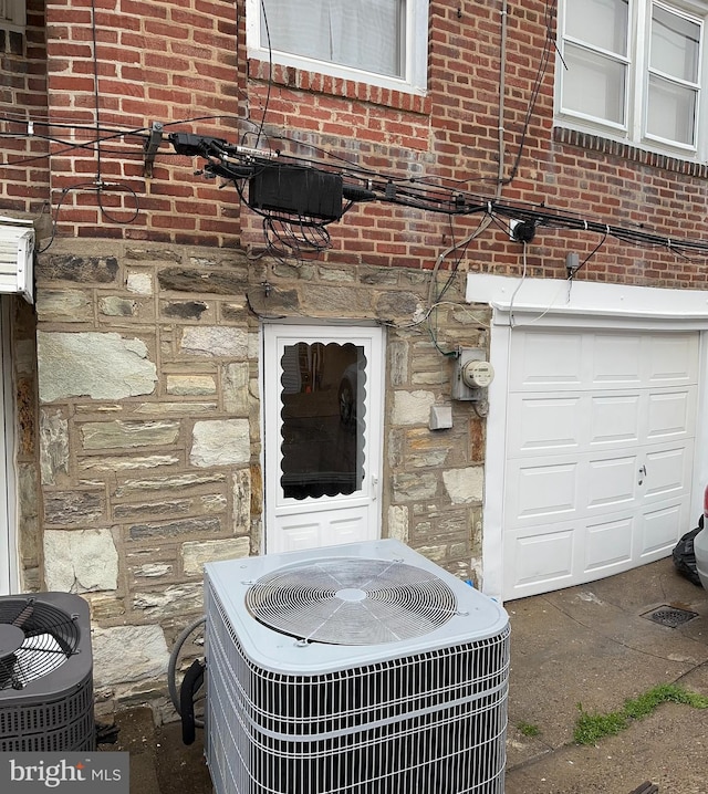 4304 Oakmont St, Philadelphia, PA 19136 - exterior view of central air condition unit, stone siding, brick siding, and electric meter