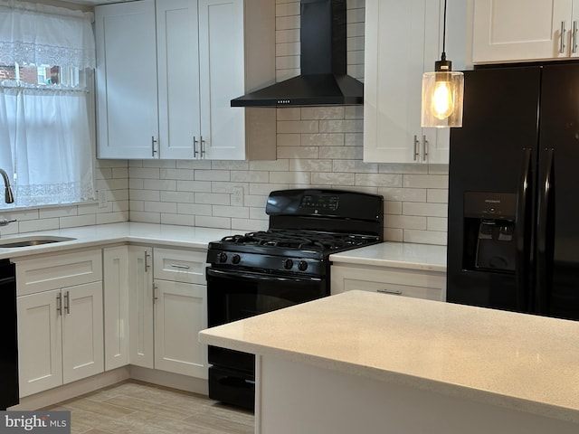 4304 Oakmont St, Philadelphia, PA 19136 - kitchen featuring wall chimney exhaust hood, black appliances, a sink, and white cabinetry