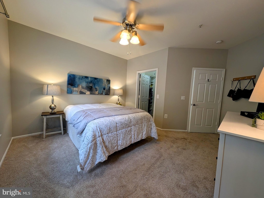 11800 Old Georgetown Rd Unit 1323, North Bethesda, MD 20852 - bedroom featuring light carpet, baseboards, a ceiling fan, and a walk in closet