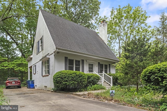 819 Elwood Rd, Hammonton, NJ 08037 - view of front facade with a chimney, roof with shingles, stucco siding, and driveway