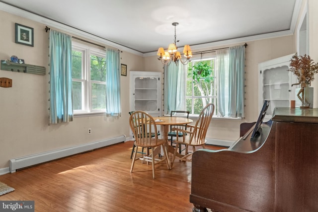 819 Elwood Rd, Hammonton, NJ 08037 - dining room featuring a baseboard radiator, crown molding, a chandelier, wood finished floors, and baseboards