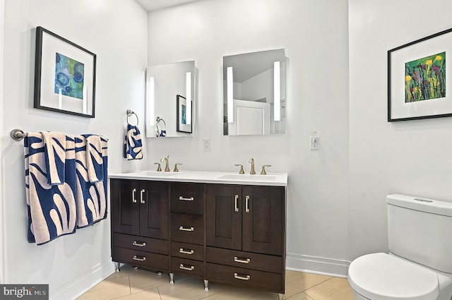 41 W Lemon St Unit 505, Lancaster, PA 17603 - full bath with baseboards, double vanity, toilet, and wood finished floors