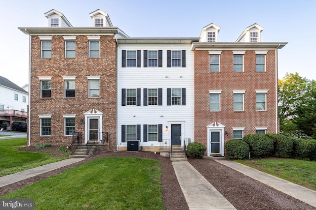 139 Flora Vista Ln, Woodstock, VA 22664 - townhome / multi-family property with central air condition unit, a front lawn, and brick siding