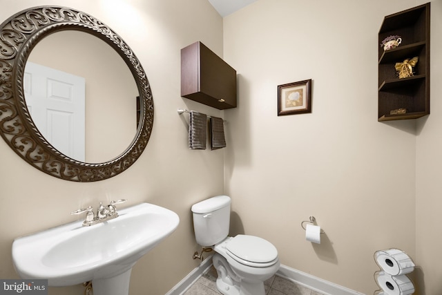 139 Flora Vista Ln, Woodstock, VA 22664 - half bathroom with a sink, toilet, tile patterned floors, and baseboards