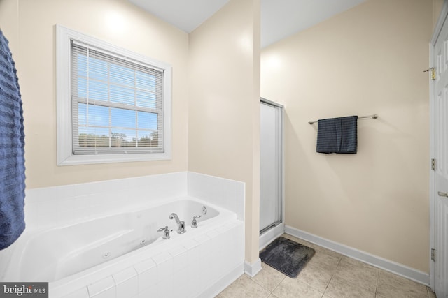139 Flora Vista Ln, Woodstock, VA 22664 - bathroom with a whirlpool tub, baseboards, a stall shower, and tile patterned flooring