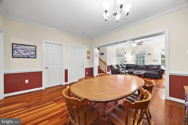 139 Flora Vista Ln, Woodstock, VA 22664 - dining area featuring stairs, hardwood / wood-style floors, crown molding, baseboards, and a chandelier
