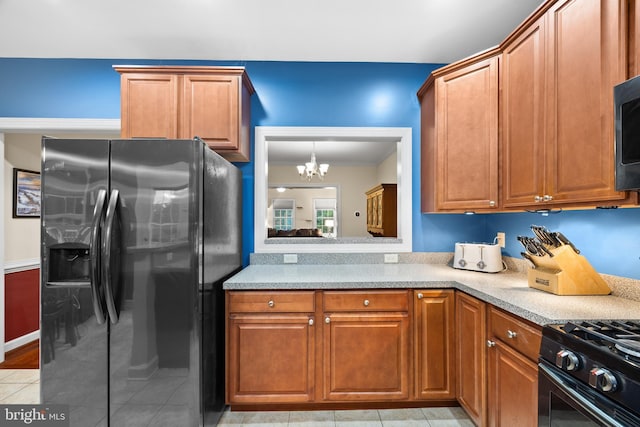 139 Flora Vista Ln, Woodstock, VA 22664 - kitchen featuring stainless steel fridge, a chandelier, brown cabinets, crown molding, and light tile patterned flooring