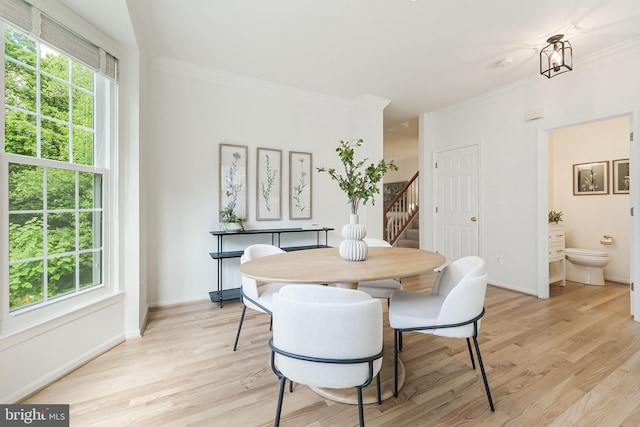 1251 Wild Hawthorn Way, Reston, VA 20194 - dining room featuring crown molding, stairway, light wood-style flooring, and baseboards