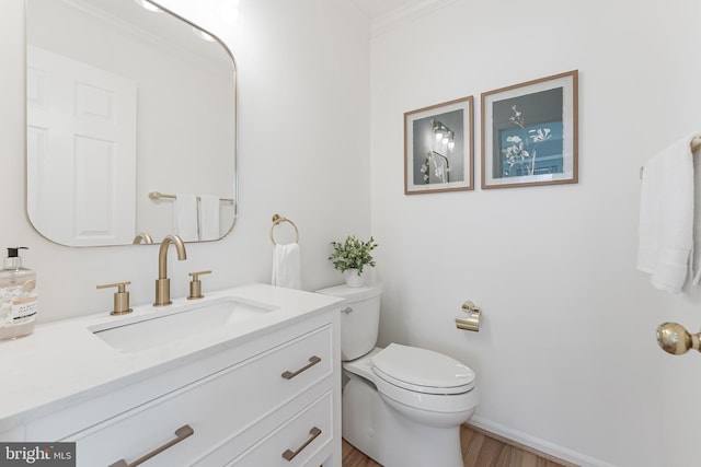 1251 Wild Hawthorn Way, Reston, VA 20194 - bathroom featuring wood finished floors, toilet, vanity, ornamental molding, and baseboards