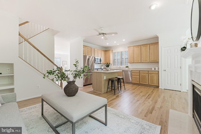 1251 Wild Hawthorn Way, Reston, VA 20194 - living room with ceiling fan, stairs, light wood finished floors, recessed lighting, and crown molding