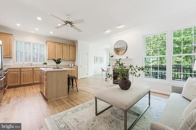 1251 Wild Hawthorn Way, Reston, VA 20194 - living room featuring ornamental molding, healthy amount of natural light, a ceiling fan, light wood-style flooring, and recessed lighting