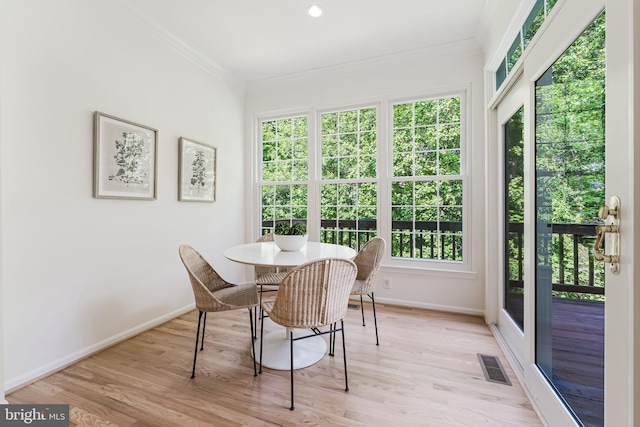 1251 Wild Hawthorn Way, Reston, VA 20194 - dining room featuring ornamental molding, baseboards, light wood finished floors, and healthy amount of natural light