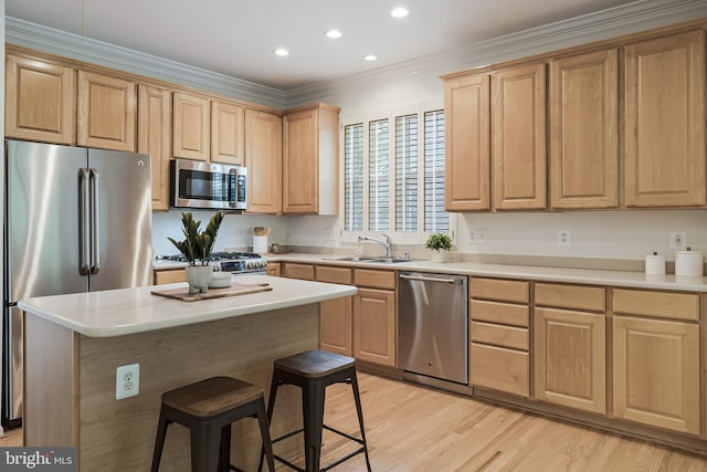 1251 Wild Hawthorn Way, Reston, VA 20194 - kitchen featuring stainless steel appliances, a kitchen breakfast bar, light brown cabinetry, light countertops, and recessed lighting