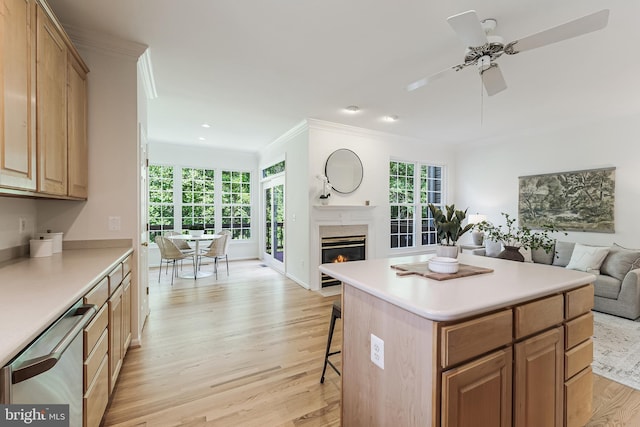 1251 Wild Hawthorn Way, Reston, VA 20194 - kitchen with open floor plan, dishwasher, light wood finished floors, crown molding, and a kitchen bar