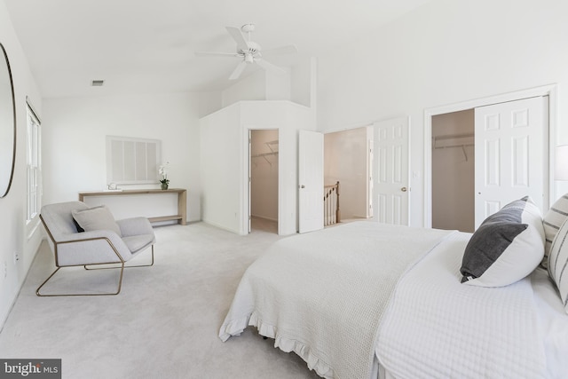 1251 Wild Hawthorn Way, Reston, VA 20194 - bedroom featuring a spacious closet, light carpet, ceiling fan, and high vaulted ceiling