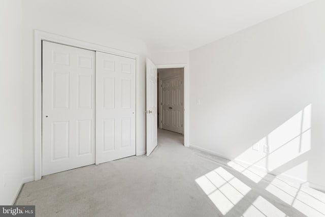 1251 Wild Hawthorn Way, Reston, VA 20194 - unfurnished bedroom featuring carpet, a closet, and baseboards