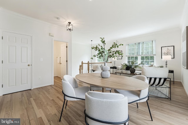 1251 Wild Hawthorn Way, Reston, VA 20194 - dining space with crown molding, light wood-style flooring, and baseboards