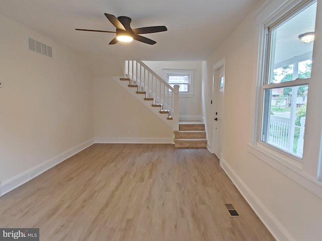 22 Leeway Rd, Baltimore, MD 21222 - entrance foyer featuring stairs, light wood-type flooring, a ceiling fan, and baseboards