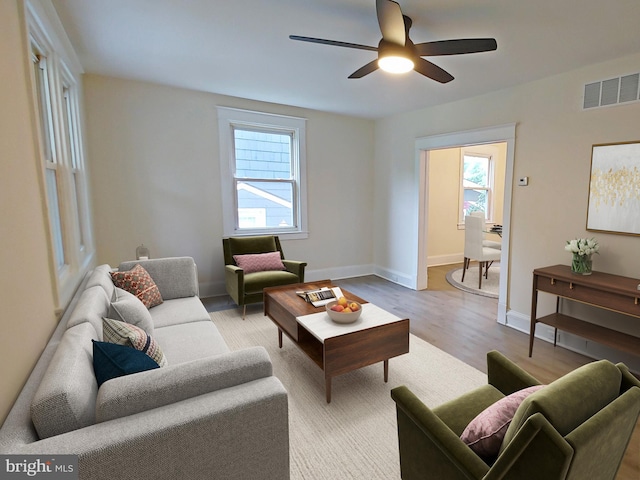 22 Leeway Rd, Baltimore, MD 21222 - living area with light wood-style flooring, ceiling fan, and baseboards