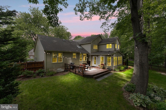 12695 Kettering Dr, Herndon, VA 20171 - back of property at dusk with a wooden deck and a shingled roof