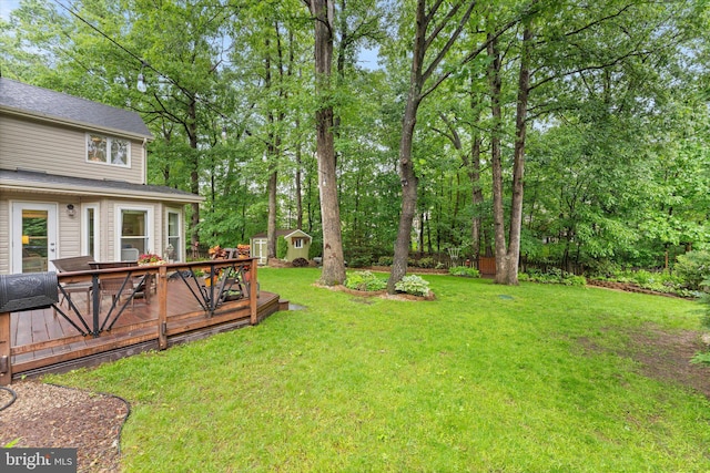 12695 Kettering Dr, Herndon, VA 20171 - view of green lawn with a wooden deck and view of scattered trees