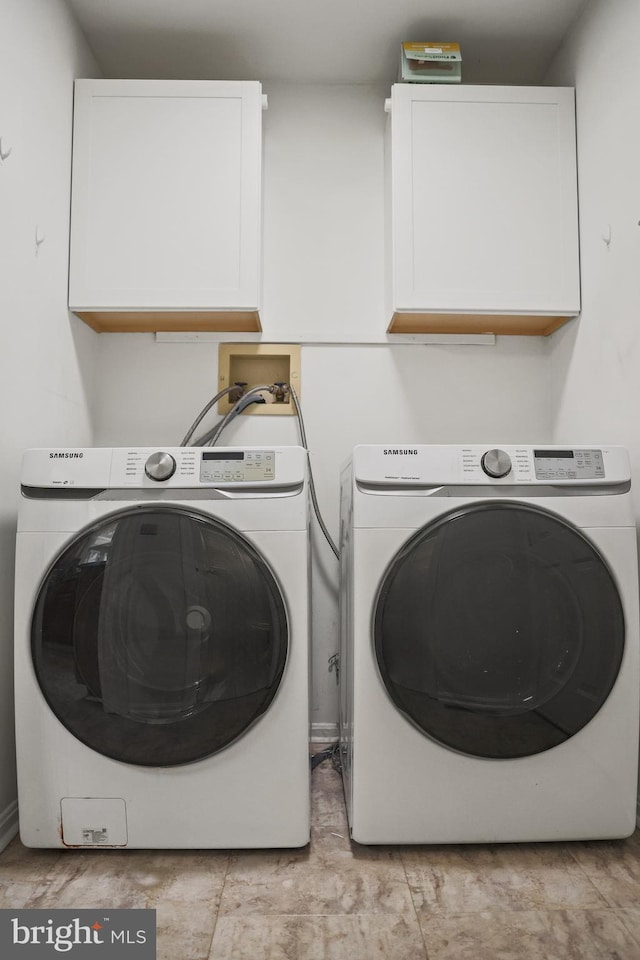 102 Gardengate Rd, Camden Wyoming, DE 19934 - laundry area with cabinet space and washer and clothes dryer