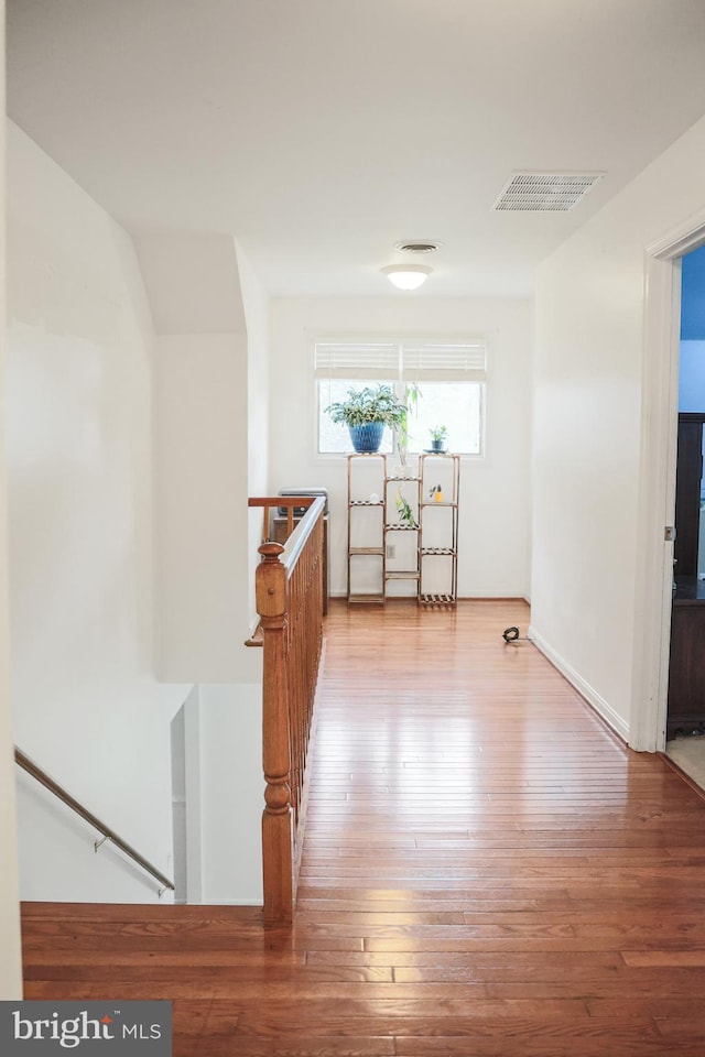102 Gardengate Rd, Camden Wyoming, DE 19934 - hallway with an upstairs landing, light wood-type flooring, and baseboards