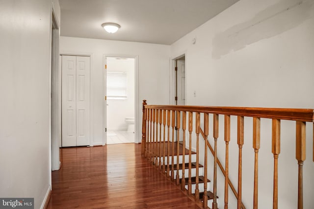 102 Gardengate Rd, Camden Wyoming, DE 19934 - hallway with wood finished floors, baseboards, and an upstairs landing