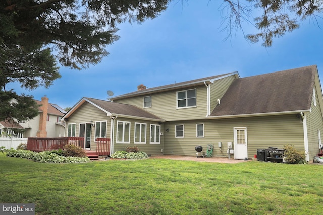 102 Gardengate Rd, Camden Wyoming, DE 19934 - back of property with a deck, a lawn, and a patio area