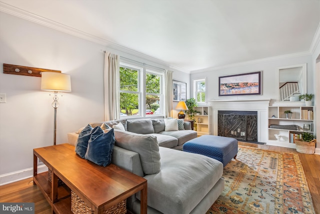 2709 Emmet Rd, Silver Spring, MD 20902 - living room featuring wood-type flooring, crown molding, a fireplace, and baseboards