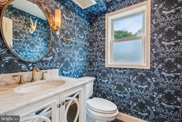 2709 Emmet Rd, Silver Spring, MD 20902 - half bathroom with wallpapered walls, toilet, and vanity