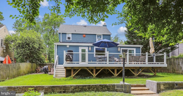 2709 Emmet Rd, Silver Spring, MD 20902 - back of property featuring a deck, a chimney, stairway, and roof with shingles