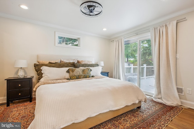 2709 Emmet Rd, Silver Spring, MD 20902 - bedroom featuring access to exterior, crown molding, baseboards, wood finished floors, and recessed lighting