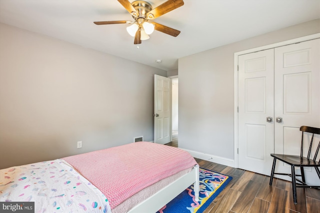 2709 Emmet Rd, Silver Spring, MD 20902 - bedroom with dark wood finished floors, a closet, ceiling fan, and baseboards