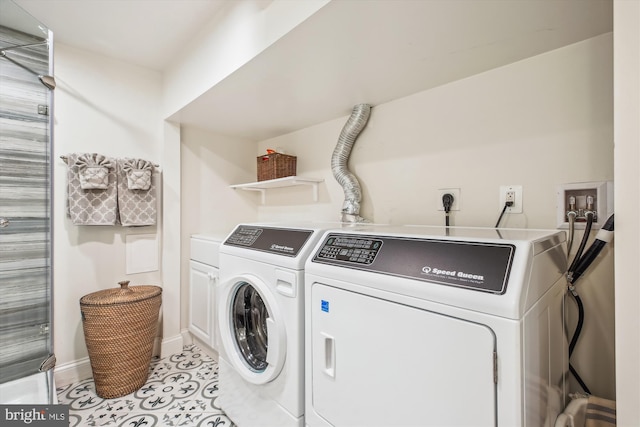 2709 Emmet Rd, Silver Spring, MD 20902 - laundry room with washer and dryer, cabinet space, baseboards, and light tile patterned floors