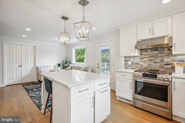 2709 Emmet Rd, Silver Spring, MD 20902 - kitchen with stainless steel gas range oven, under cabinet range hood, ornamental molding, tasteful backsplash, and open floor plan