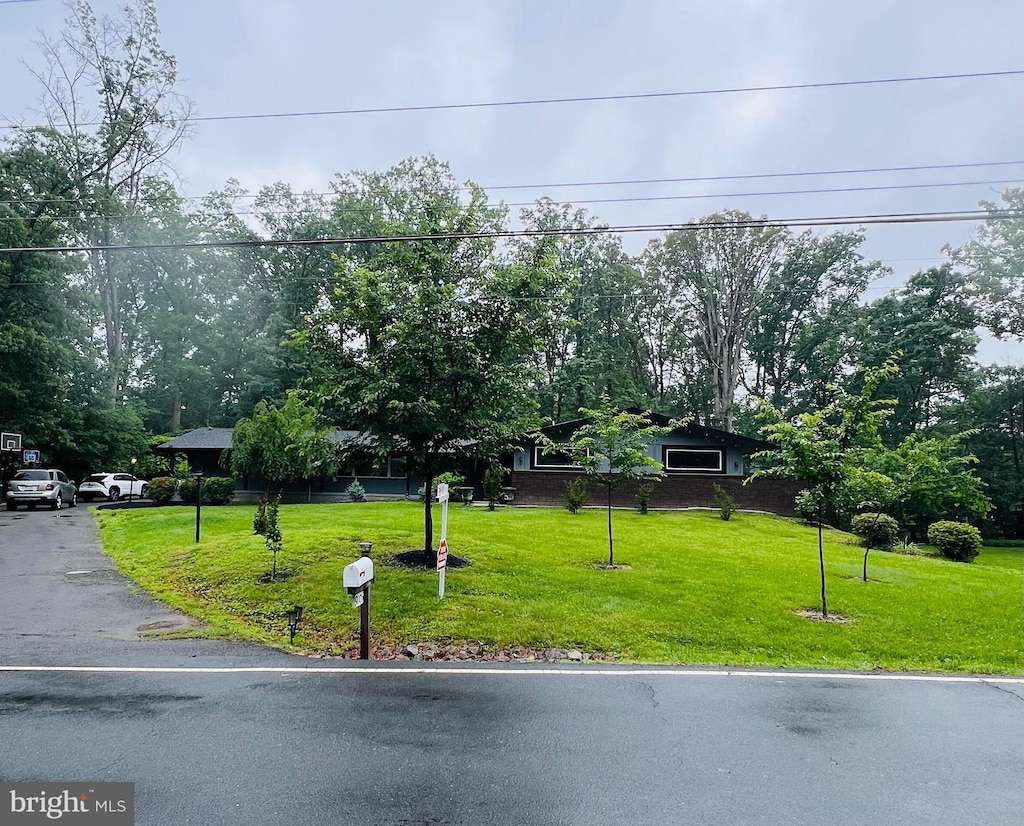 9005 Southwick St, Fairfax, VA 22031 - obstructed view of property featuring a front lawn