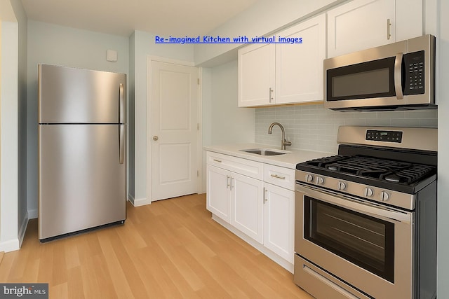 8024 Kimberly Rd, Dundalk, MD 21222 - kitchen featuring appliances with stainless steel finishes, a sink, light wood finished floors, and tasteful backsplash