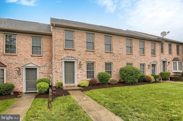 205 Saddle Ridge Dr, Harrisburg, PA 17110 - view of property featuring a front yard, brick siding, and roof with shingles